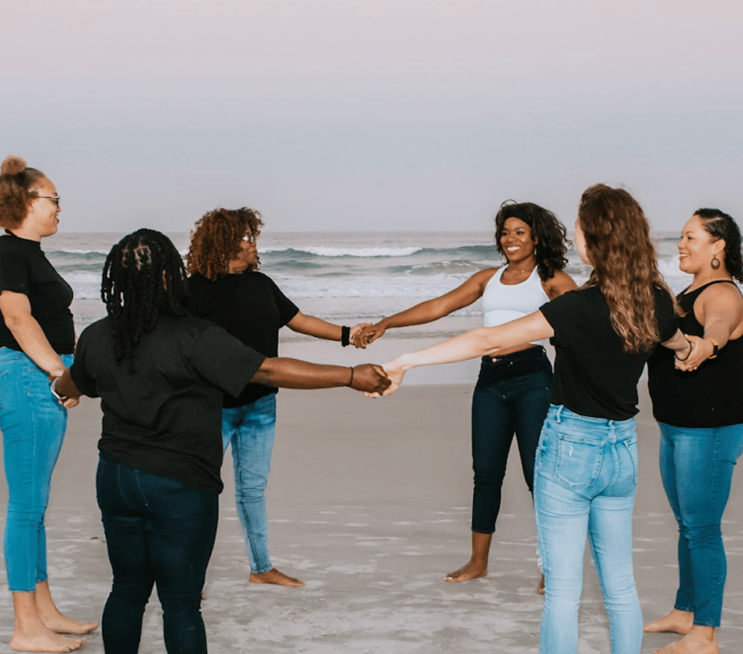 Soul Gym's 5-day women wellness retreat. Playa Del Carmen beachscape with blue filter over it and the words "relax, play, and discover: The NOPE retreat, hosted by soulgym"